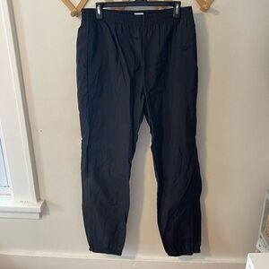 Vintage black Reebok nylon track pants in size L